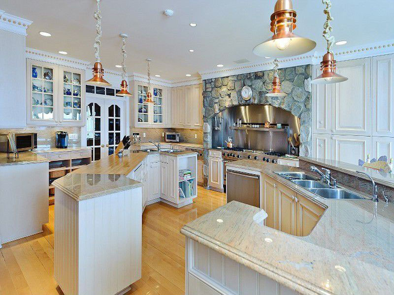 Eclectic Kitchen With Colonial White Granite Countertops