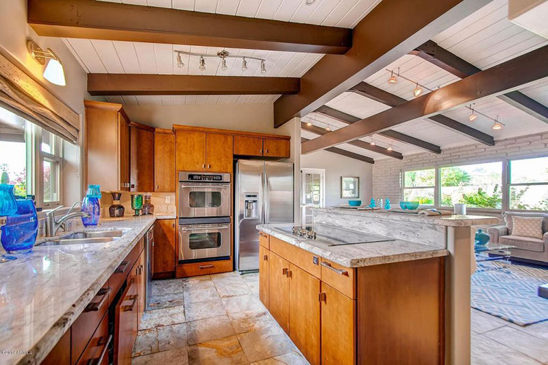 Traditional Kitchen With River White Granite Countertops