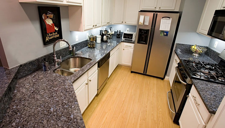 White kitchen cabinets with blue pearl granite