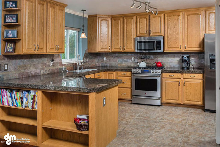 Craftsman kitchen with blue pearl countertops