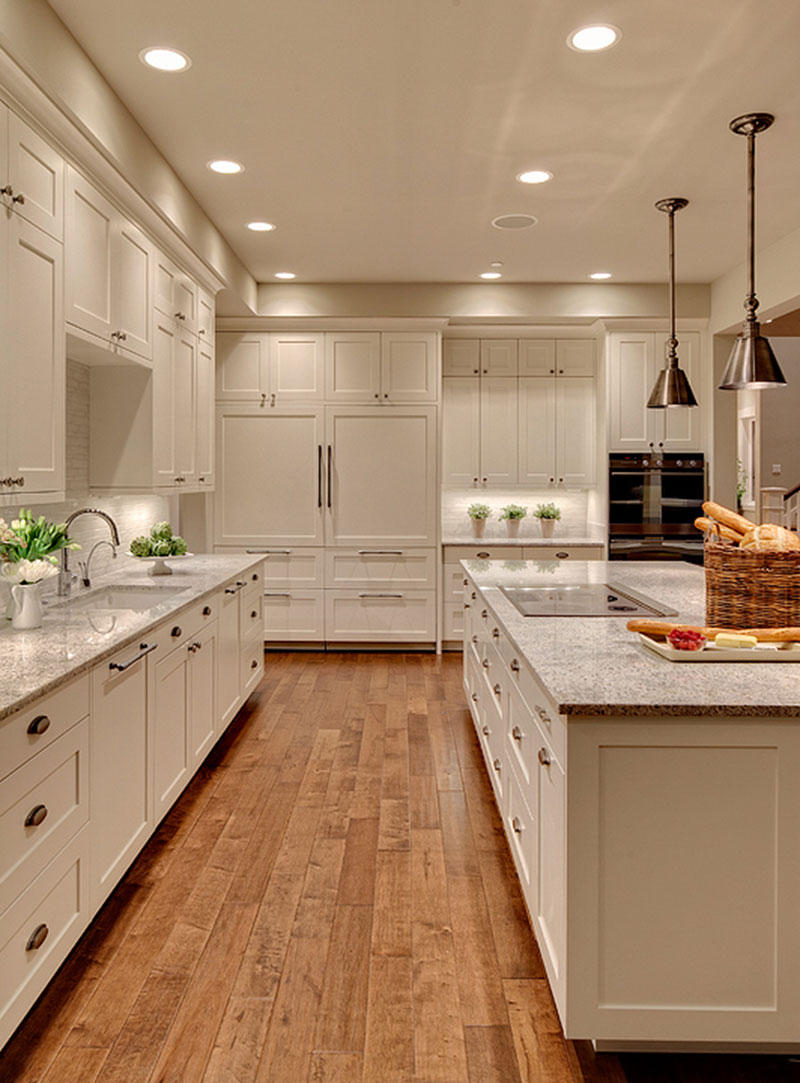 Kitchen With White Cabinets And Kashmir White Granite Countertops