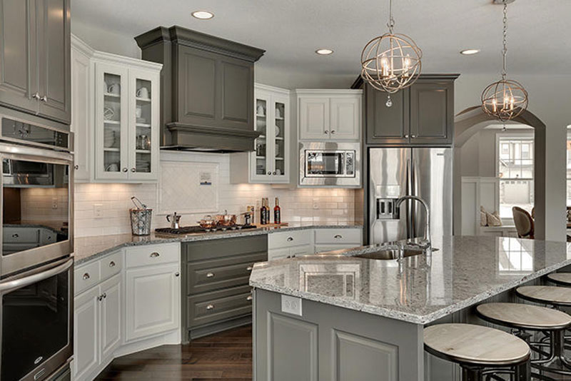 Kitchen With Gray Cabinets And Moon White Granite Countertops